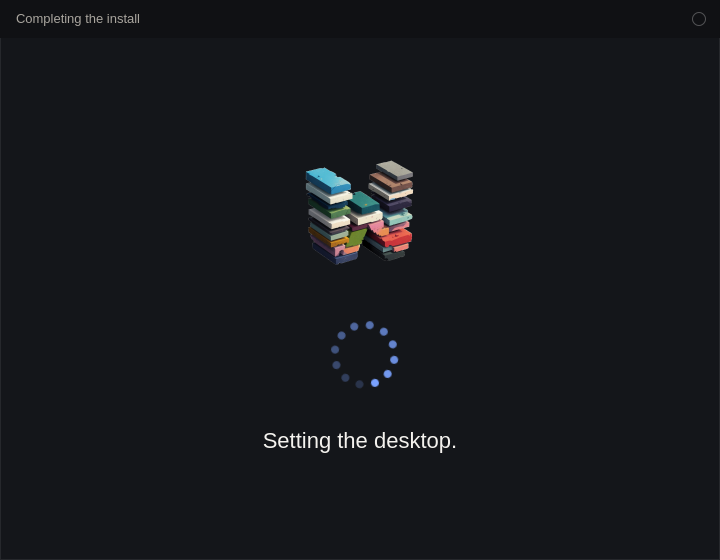 Completing the install. The WASD logo is above a ring of dots, and the line says Setting the desktop.